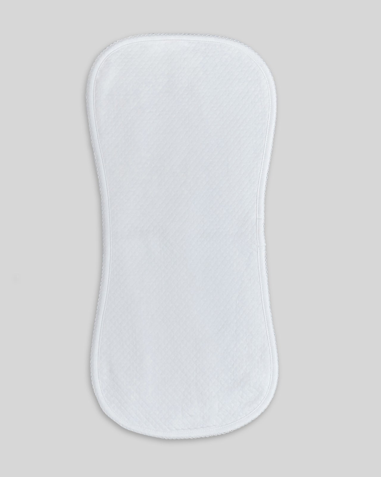 White quilted pima burp cloth for babies, elegant and practical for daily use.