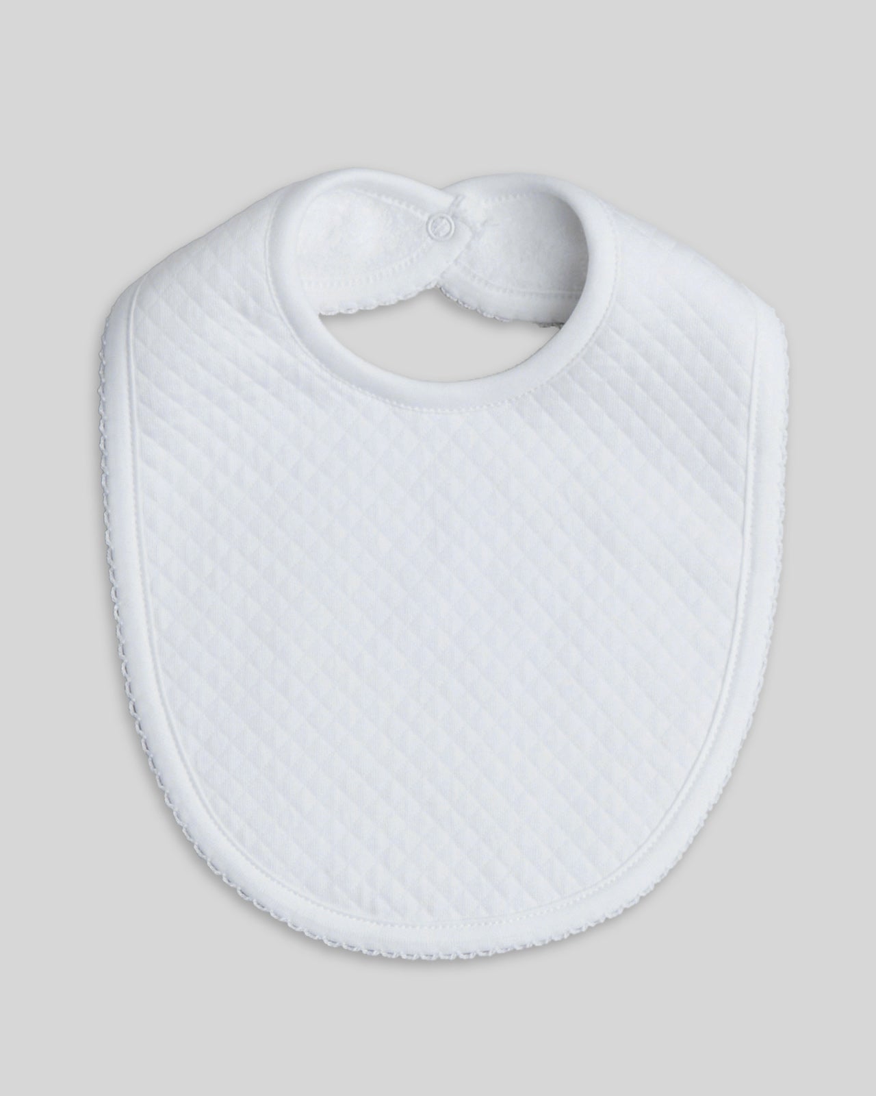 White bibs made from soft, absorbent cotton, suitable for newborns and infants.